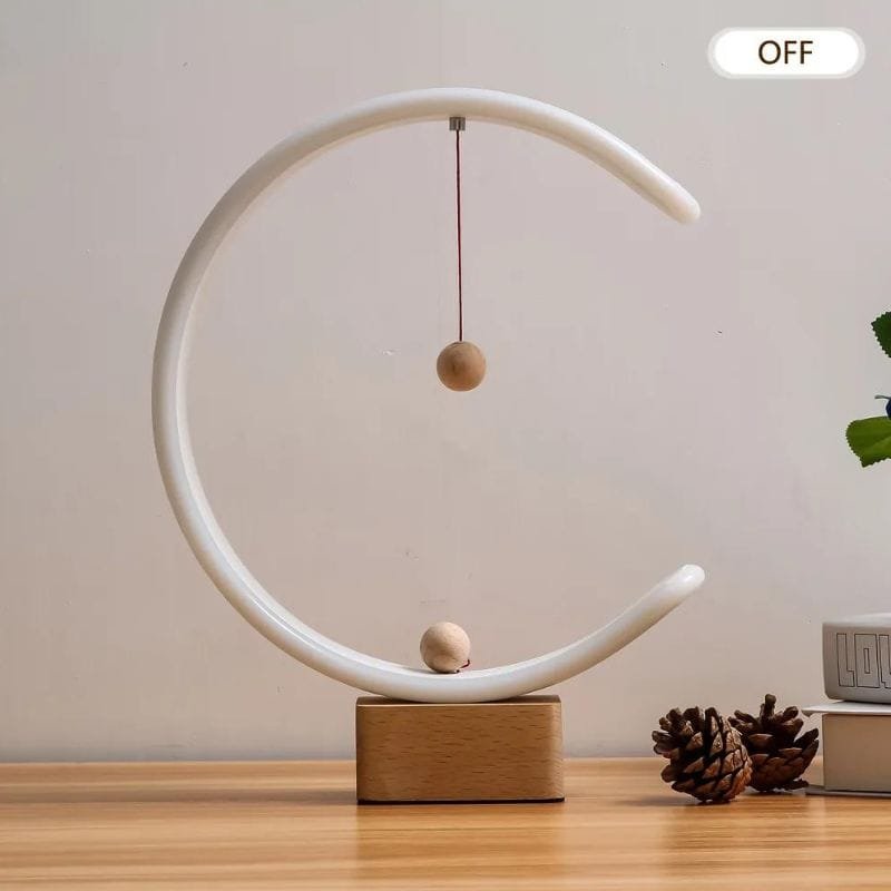 Lampe de chevet led design éteinte sur un meuble en bois